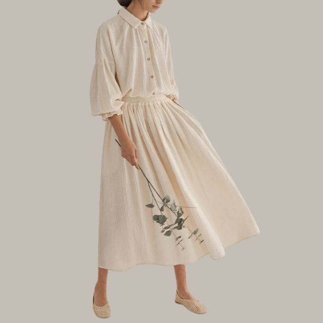 Vintage-inspired blouse and pleated midi skirt set