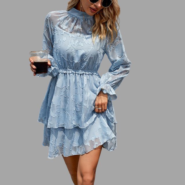 Flowing tiered mini dress with embossed floral detail